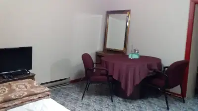 Uptown fully furnished non-smoking basement room in a private home on King street east: Large with a...