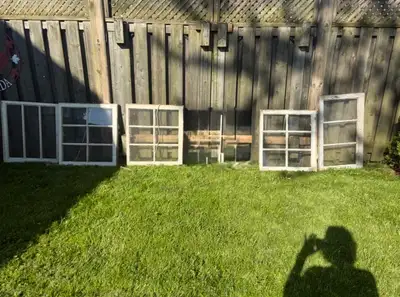 Price reflects $20 each These vintage wooden frame windows, showing authentic wear and rustic charm,...