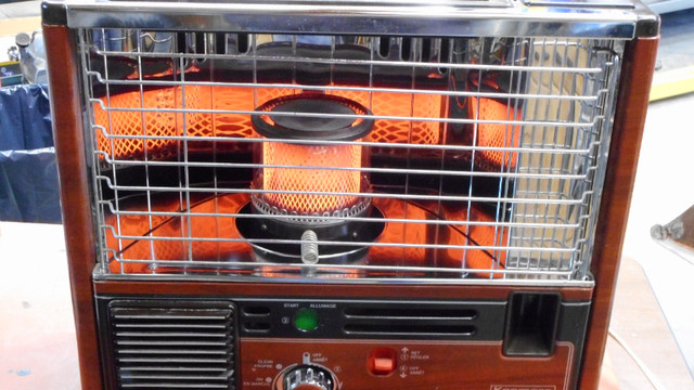Portable Kerosene - Fired Heater in Fireplace & Firewood in Belleville