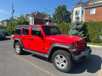 Experience the ultimate adventure in this vibrant red 2018 Jeep Wrangler Unlimited, featuring a spac...