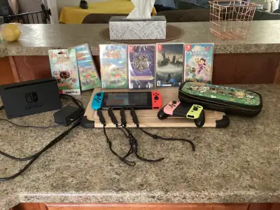 Nintendo switch with accessories and games, View more