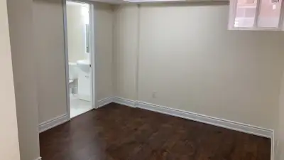 One room is available in sharing for a girl in a basement of two rooms two bathrooms
