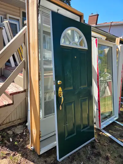 Entrance door and storm door 35"H x 84"H full size. The lock has the key