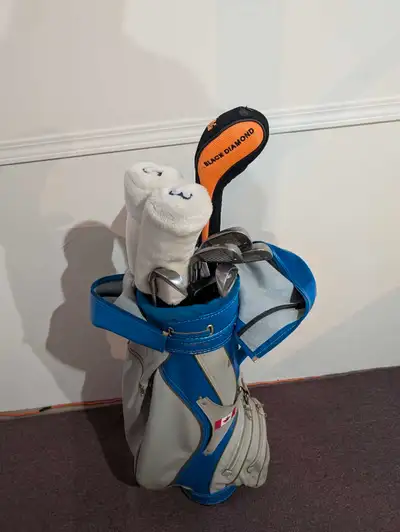 golf clubs and cart, View more