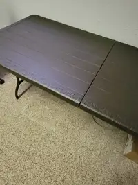 BROWN PLASTIC FOLDING TABLE