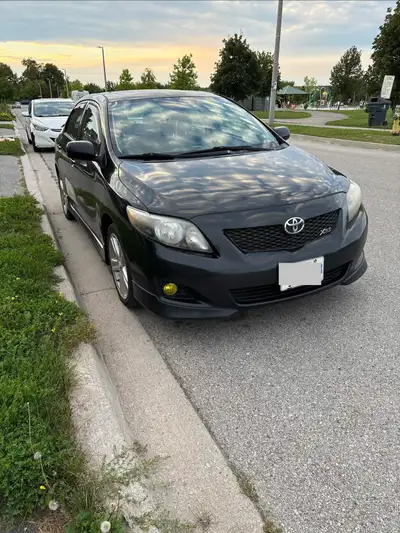 Reliable black 2009 Toyota Corolla XRS sedan. Manual transmission. Comes with a set of winter tires...
