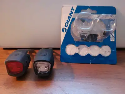 Brand New used Once. Front and Rear Lights. Batteries Included. Plus extra clip on lights for jacket...