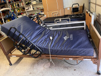 Hospital bed with new medical mattress and rails 