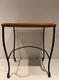 Table on wrought iron legs made in Malaysia