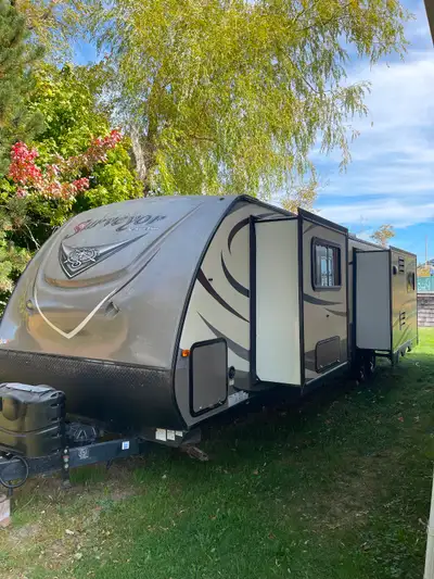 Beautiful couples trailer with three slides. Large kitchen with island. Large comfy living room with...