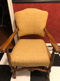 Vintage Upholstered chair with solid wood arms and legs