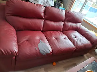 Free red leather couch. Has just some wear on one of the cushions, otherwise the couch is in good co...
