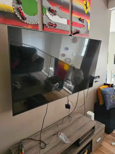 I'm selling a used 65-inch Samsung Tizen Smart TV, model QN65Q70AAF, that delivers stunning picture...