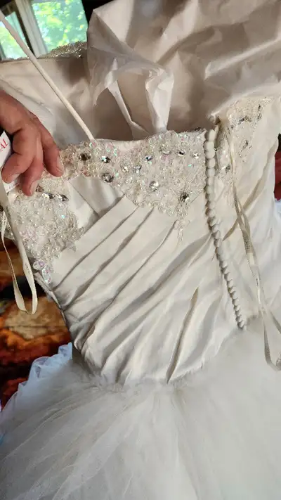 I had custom beadwork added (can still see the black thread holding the tacked lace on - that can be...