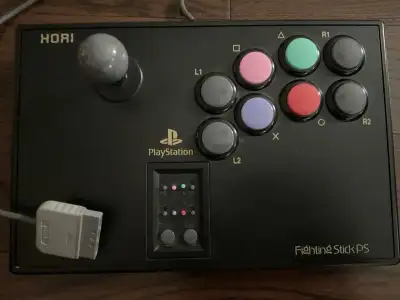 Get ready to rumble with this HORI FightingStickPS for the PlayStation 2! This arcade stick is in us...