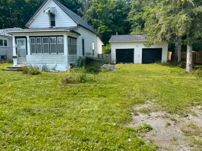 Lot 74x260' (irregular) on desireable Malcolm St. House in poor condition. Excellent double garage....
