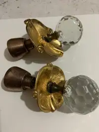 Antique looking door handles made from  glass and  bras