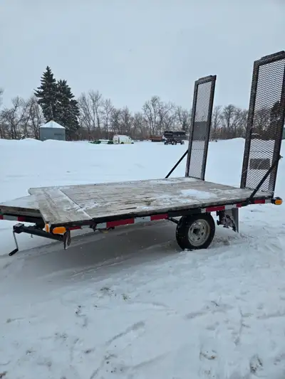 Flat deck trailer with rear ramps. bumper hitch. Lights all work. Great for hauling mowers, quad, sn...