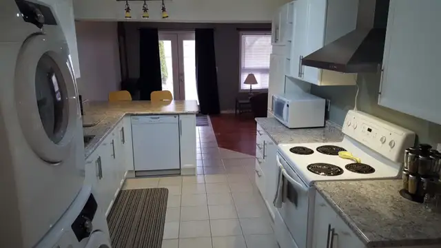 Bright walkout basement apt all inclusive 2 bed yard and parking