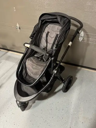 This is a used Baby Jogger City Select stroller in good condition, perfect for navigating city stree...