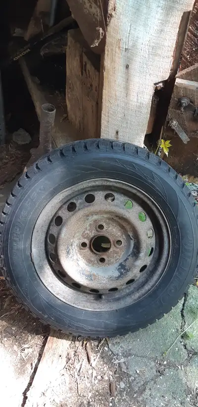 4 winter tires on rims, used less than one season. Size is 185/65 R14, brand is Hankook. Price of $2...