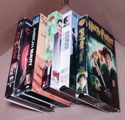 Dive into nostalgia with this collection of VHS movie tapes, featuring various titles and genres for...