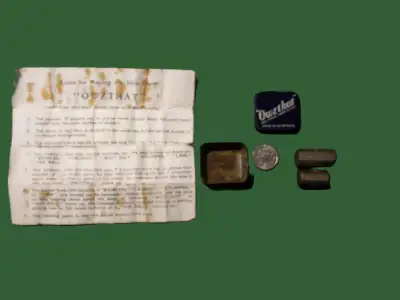 This is an original game contained in a 1" x 1" x 1/2" tin, from the 1960's, "made in Great Britain"...