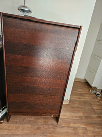 Nice wood cabinet with rolling front and a file shelf.