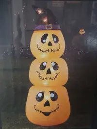 Lighted stacked Jack-O-Lanterns