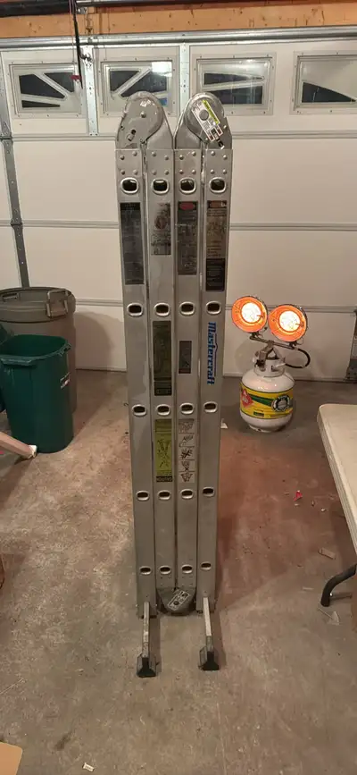 This is a used Mastercraft ladder, perfect for various tasks around the house or on the job site. Th...