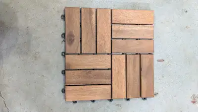 Approximately 45 whole 12"x12" Ikea decking tiles with additional partial pieces.
