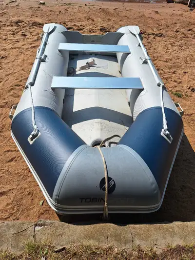 Tobin Sport Inflatable 10'8". Comes with 2 aluminum seats and 2 aluminum paddles. Bought last year,...