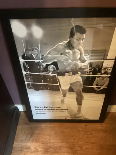 Large Glass Framed Muhammad Ali Poster with his famous his I'm so fast quote. Poster is 27"W by 39"L...