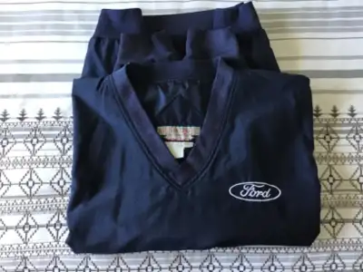Men's navy lightweight nylon lined windbreaker jacket with Ford logo. Has 2 side pockets. Size mediu...