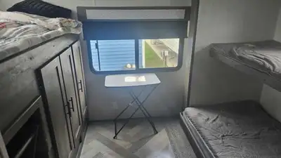 33ft travel trailer with 3 slide outs and outdoor kitchen. Sleeps 7. In excellent condition.washer d...