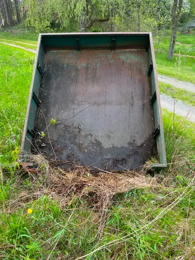 Trailer roughly the size of a pickup bed (6x5x1 feet), and I believe pivots to allow dumping. Tires...
