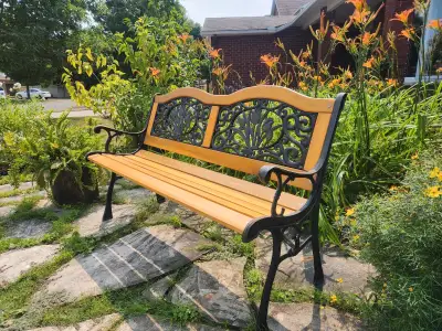 Add a touch of charm to your outdoor space with this garden and patio bench. It is made with solid w...