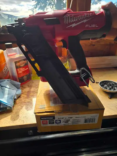 Milwaukee 2745-20 framing nailer with box of nails, View more