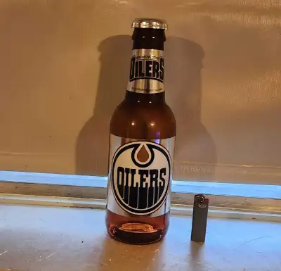 Oilers Beer Bottle Coin Bank, View more