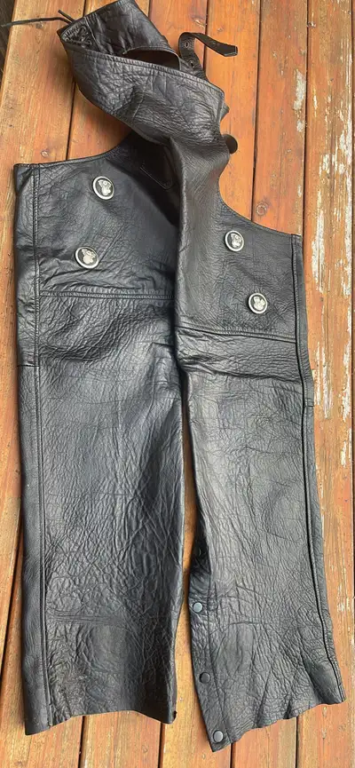 Ladies Large leather chaps in great condition . Adjustable belt and zippers on the side with snaps....