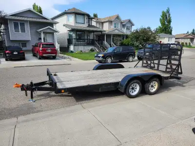 2010 flat deck trailer Axel's 3500 lbs each. Spring loaded attached ramp. Deck is 7' wide, 16' long...