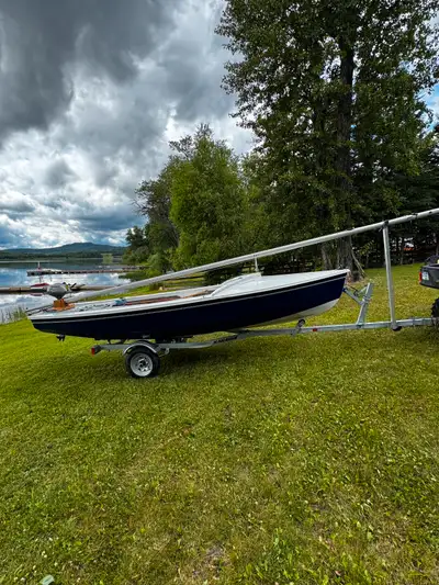 16’ Wayfarer sailboat, two sails, retractable centerboard and rudder. Comes with 2006 Honda 4 stroke...