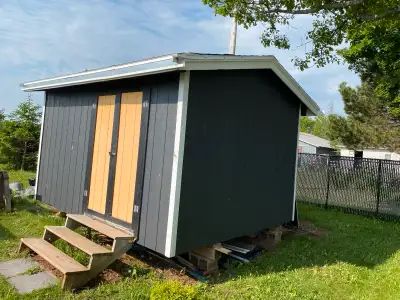 Garden Shed 4 Years Old. Wired. Window. Very Good Condition. Jacked up and ready to move.