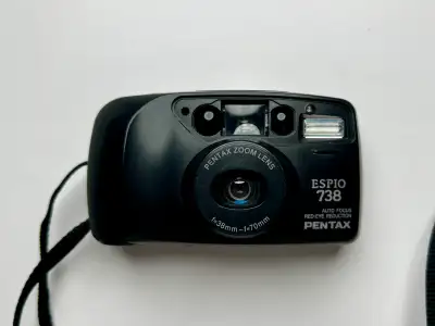 Selling a Pentax Espio 738. Powers on, takes shots, advances film, and the flash works, but the zoom...