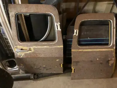 2 pairs of 67-72 suburban barn doors in good condition will trade for 67 gmc drivers front fender, f...