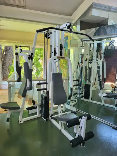 Quality complete home gym with 210 lb weight stack designed to develop every major muscle group. Cur...