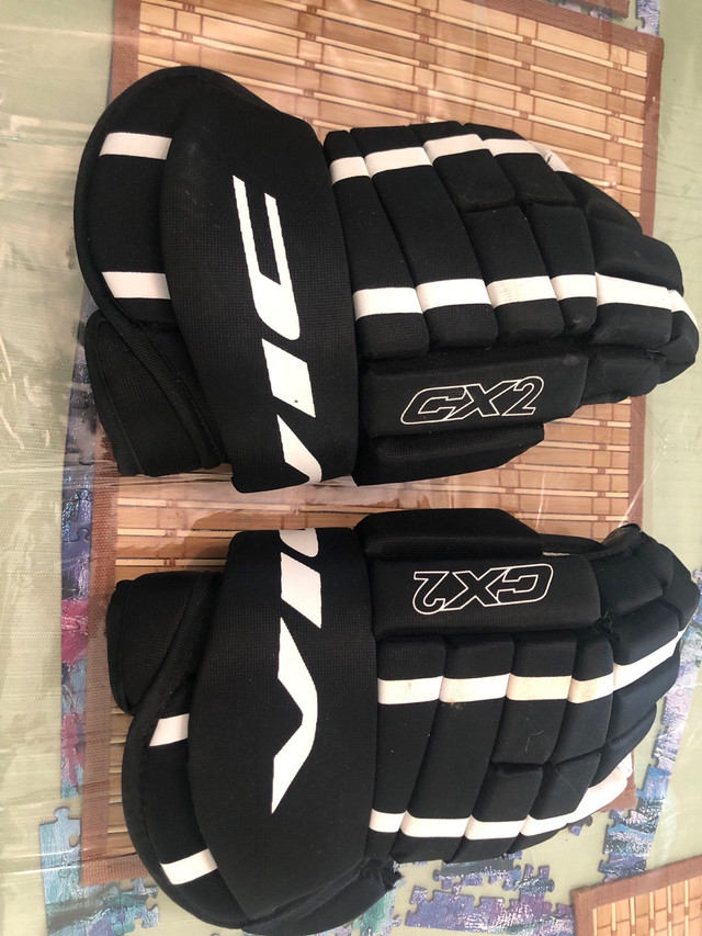 Bauer skates with hockey gloves in Skates & Blades in Edmonton - Image 3