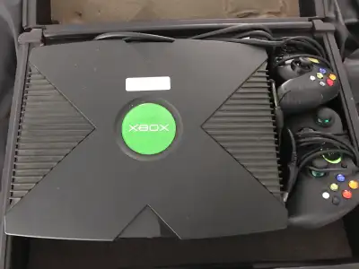 Xbox console with 2 controllers