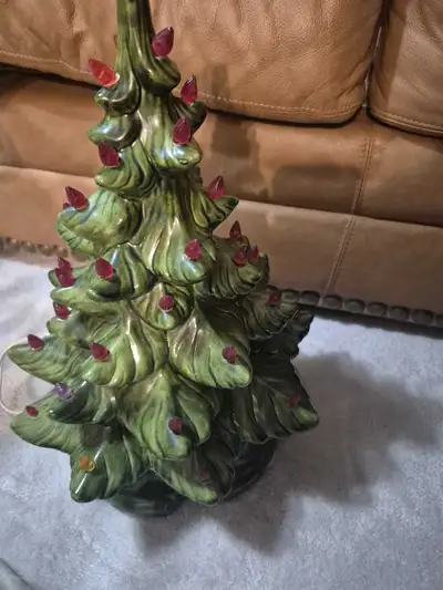 I'm selling a used vintage ceramic Christmas tree with red lights, perfect for adding a nostalgic to...