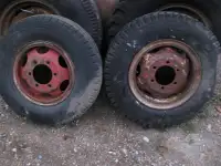 various oddball tires and rims from old trucks / equipment